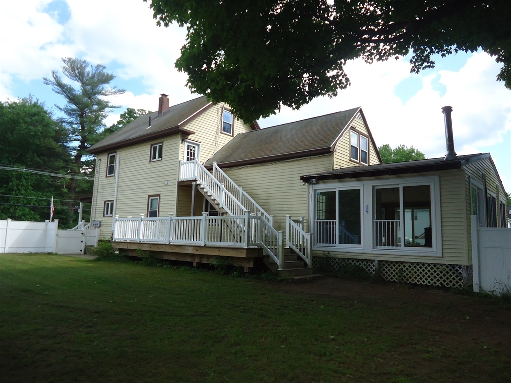 361 River Road Hudson, MA 01749 - Photo 3 of 37 a view of a house with a backyard