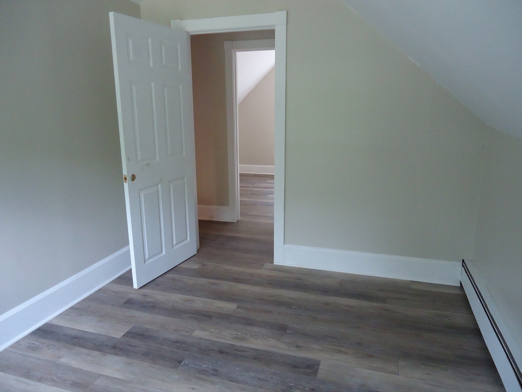 361 River Road Hudson, MA 01749 - Photo 32 of 37 a view of a hallway with wooden floor