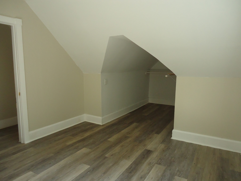 361 River Road Hudson, MA 01749 - Photo 34 of 37 a view of a big room with wooden floor