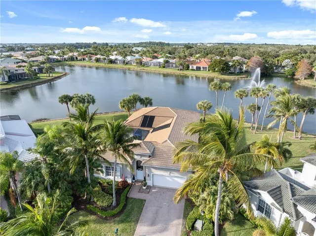 an aerial view of a houses with lake view