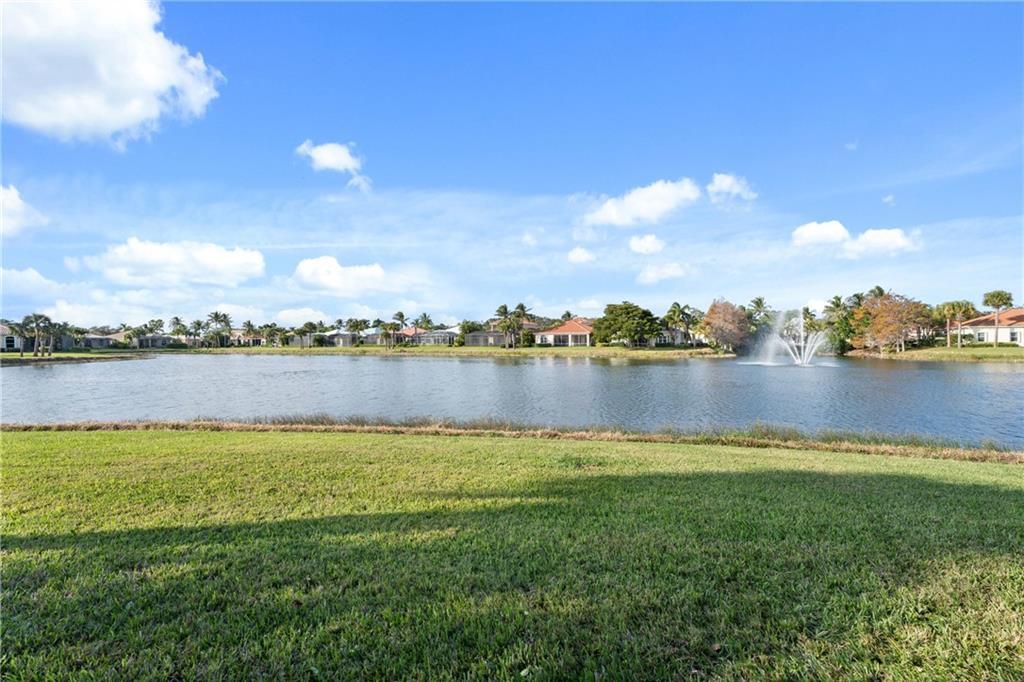 1344 Riverside Lane Vero Beach, FL 32963 - Photo 21 of 36 a view of a lake with houses in the back