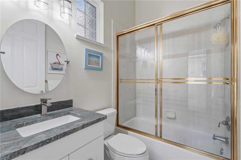 1344 Riverside Lane Vero Beach, FL 32963 - Photo 25 of 36 a bathroom with a granite countertop sink toilet and shower