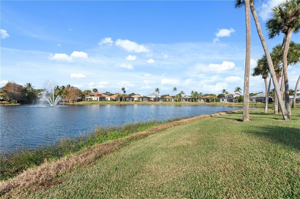 1344 Riverside Lane Vero Beach, FL 32963 - Photo 27 of 36 a view of a lake with houses in the back