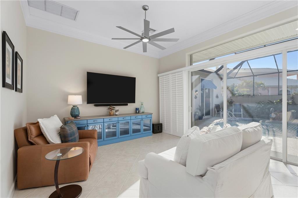 1344 Riverside Lane Vero Beach, FL 32963 - Photo 10 of 36 a living room with furniture and a flat screen tv