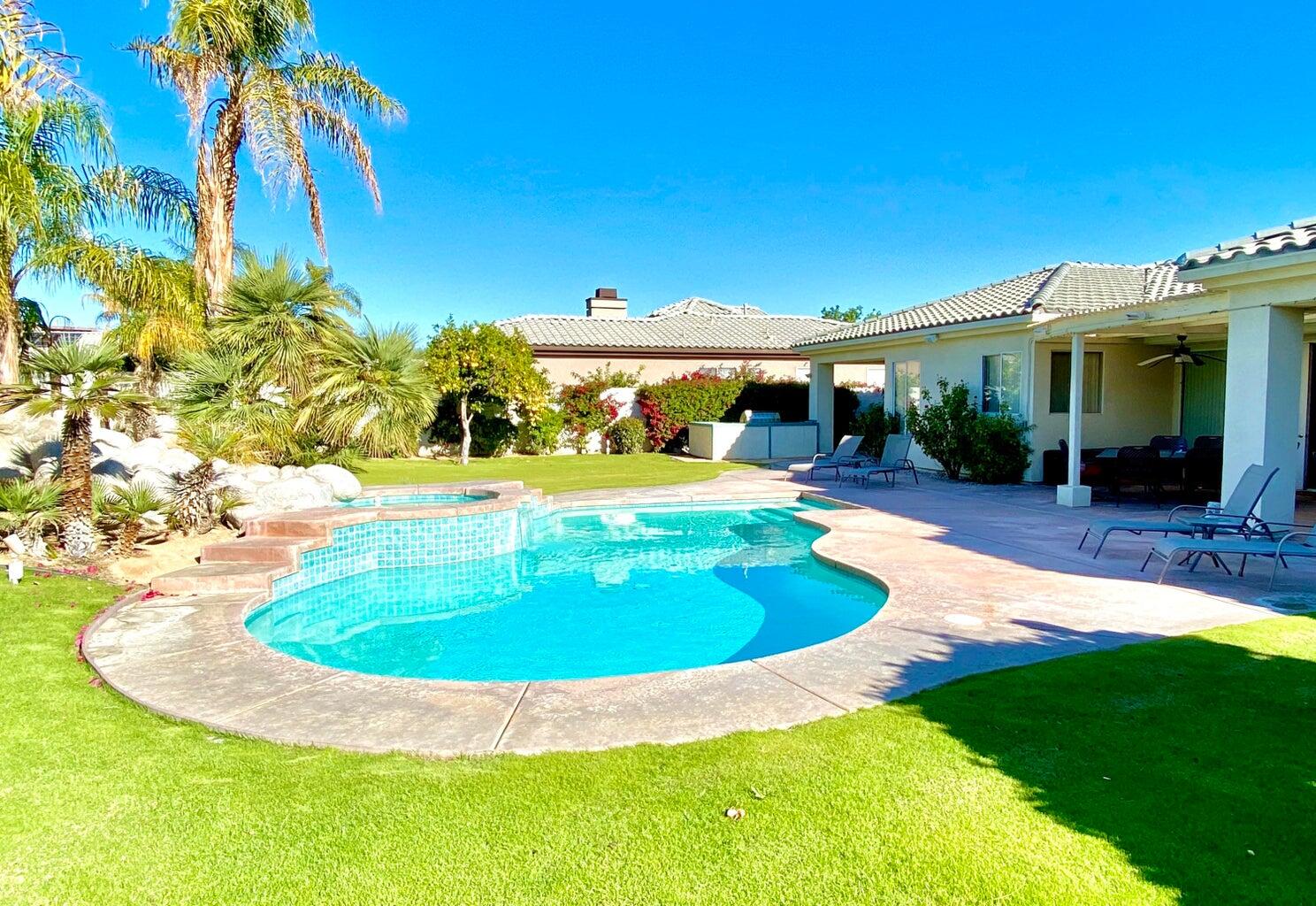 5 Victoria Falls Drive Rancho Mirage, CA 92270 - Photo 13 of 26 a view of a house with a backyard