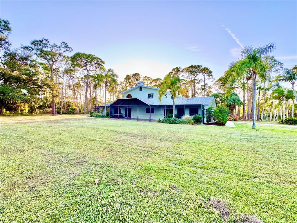 6068 Tidwell Street North Port, FL 34291 - Photo 16 of 92 a view of a building with a garden