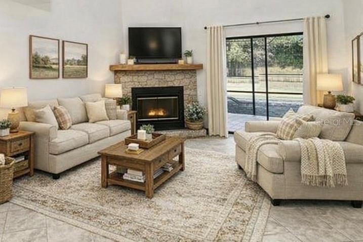 6068 Tidwell Street North Port, FL 34291 - Photo 40 of 92 a living room with furniture a flat screen tv and a fireplace