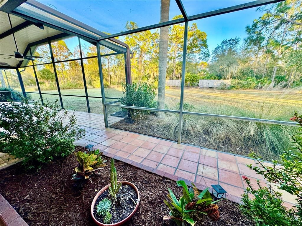 6068 Tidwell Street North Port, FL 34291 - Photo 49 of 92 a garden view with a seating space