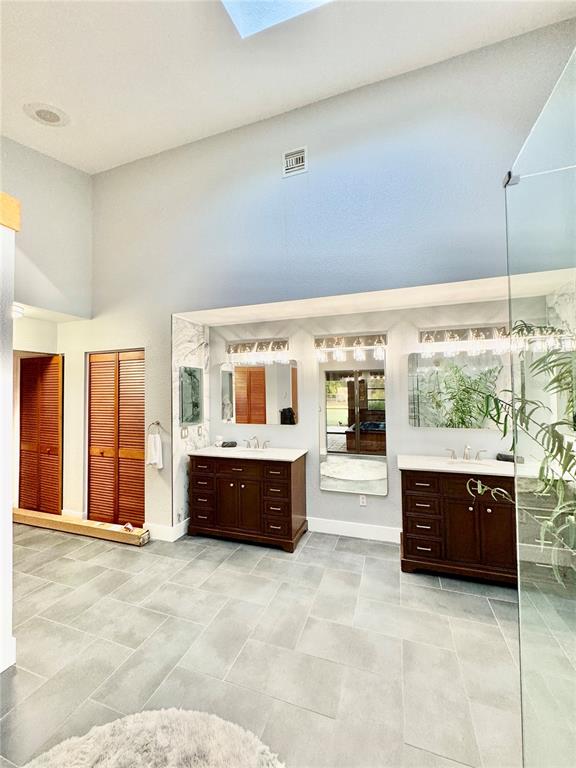 6068 Tidwell Street North Port, FL 34291 - Photo 57 of 92 a large spacious bathroom with a large tub and shower