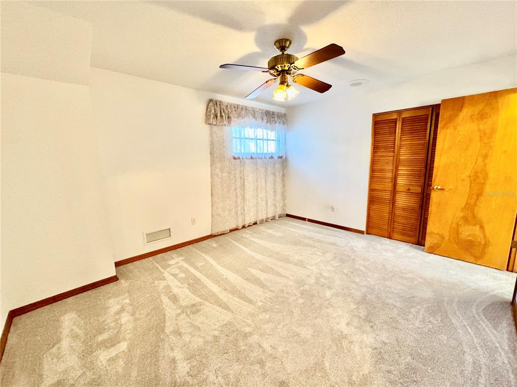 6068 Tidwell Street North Port, FL 34291 - Photo 64 of 92 a view of an empty room with a window