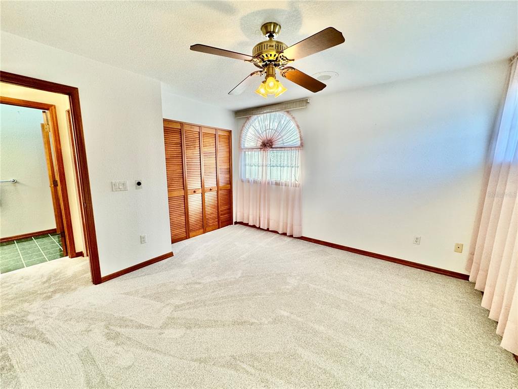 6068 Tidwell Street North Port, FL 34291 - Photo 66 of 92 a view of livingroom with hardwood floor and ceiling fan