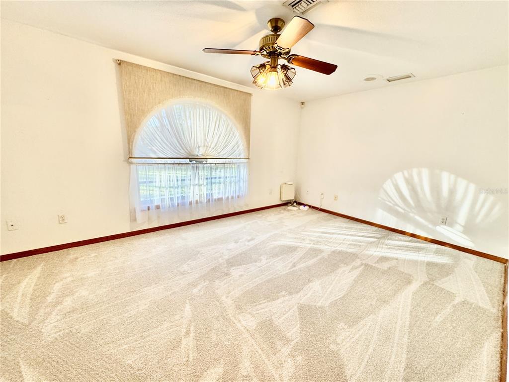 6068 Tidwell Street North Port, FL 34291 - Photo 72 of 92 a view of an empty room with a window