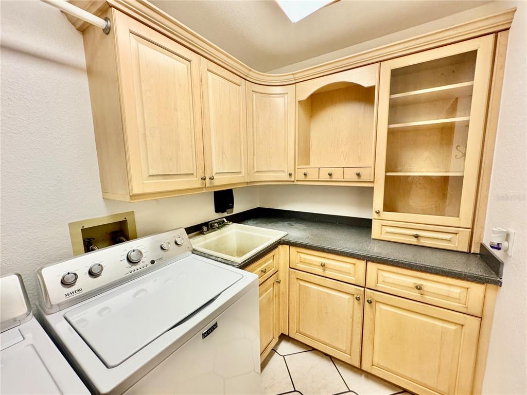 6068 Tidwell Street North Port, FL 34291 - Photo 76 of 92 a utility room with dryer and washer