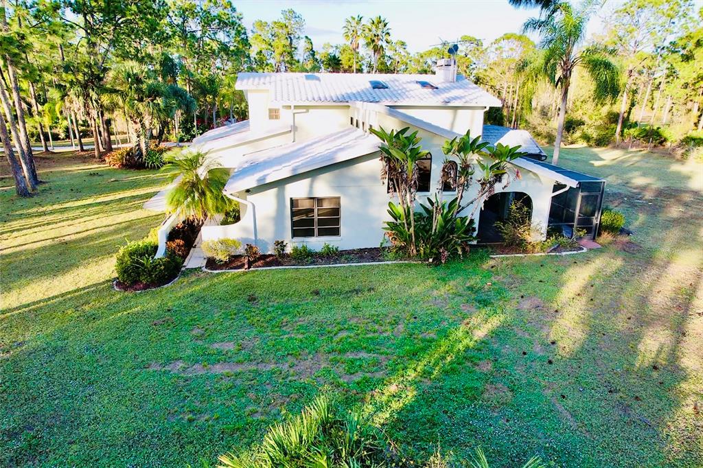 6068 Tidwell Street North Port, FL 34291 - Photo 87 of 92 a front view of house with garden