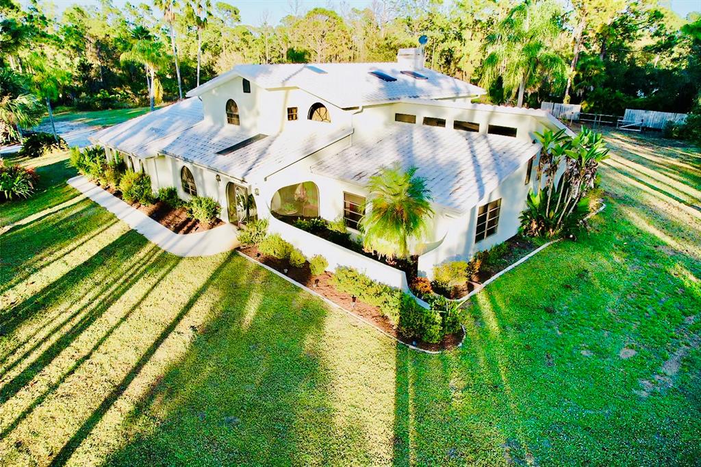 6068 Tidwell Street North Port, FL 34291 - Photo 88 of 92 an aerial view of a house with a yard