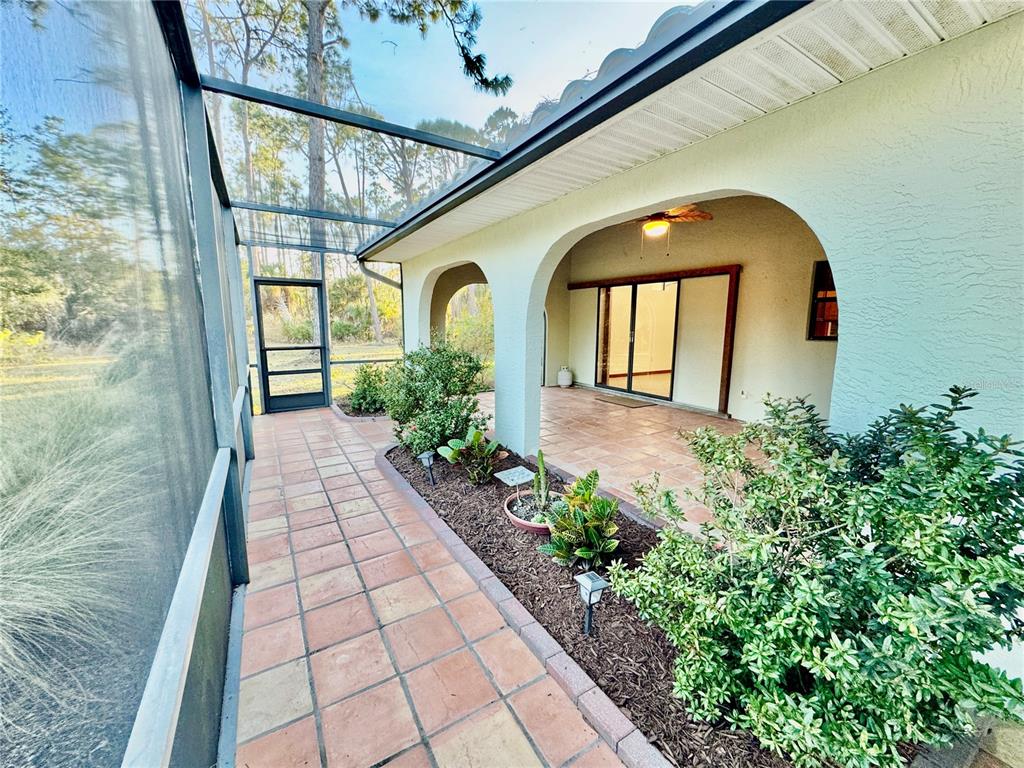 6068 Tidwell Street North Port, FL 34291 - Photo 89 of 92 a front view of a house with garden