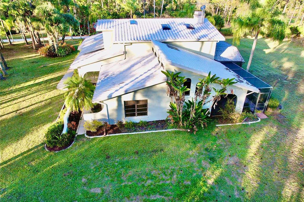 6068 Tidwell Street North Port, FL 34291 - Photo 10 of 92 a view of a house with a yard