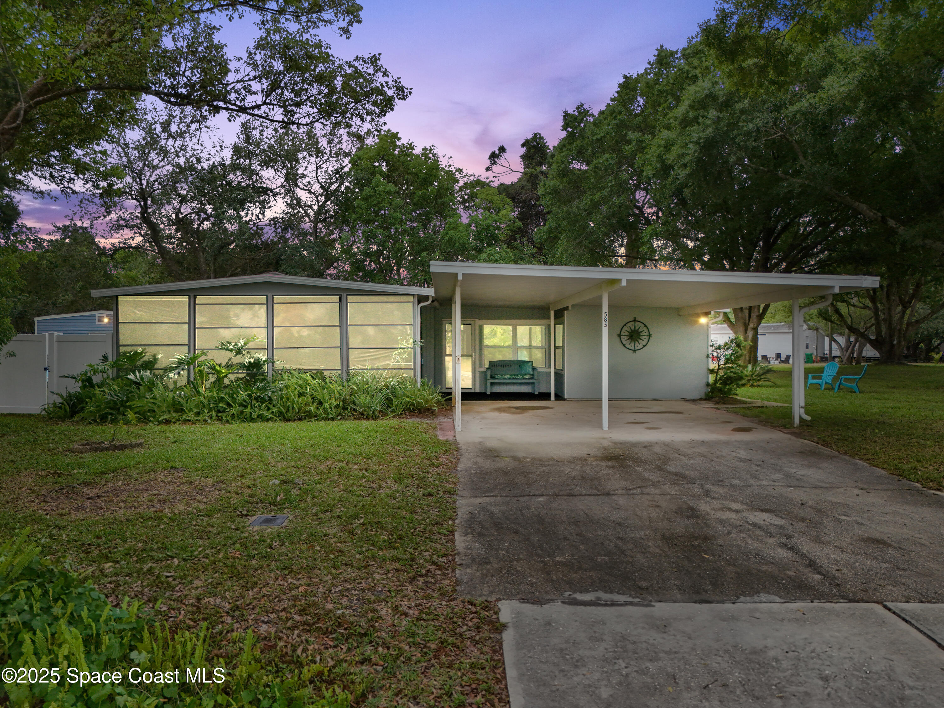 585 Canaveral Groves Boulevard Cocoa, FL 32926 - Photo 1 of 49 a view of a house with backyard