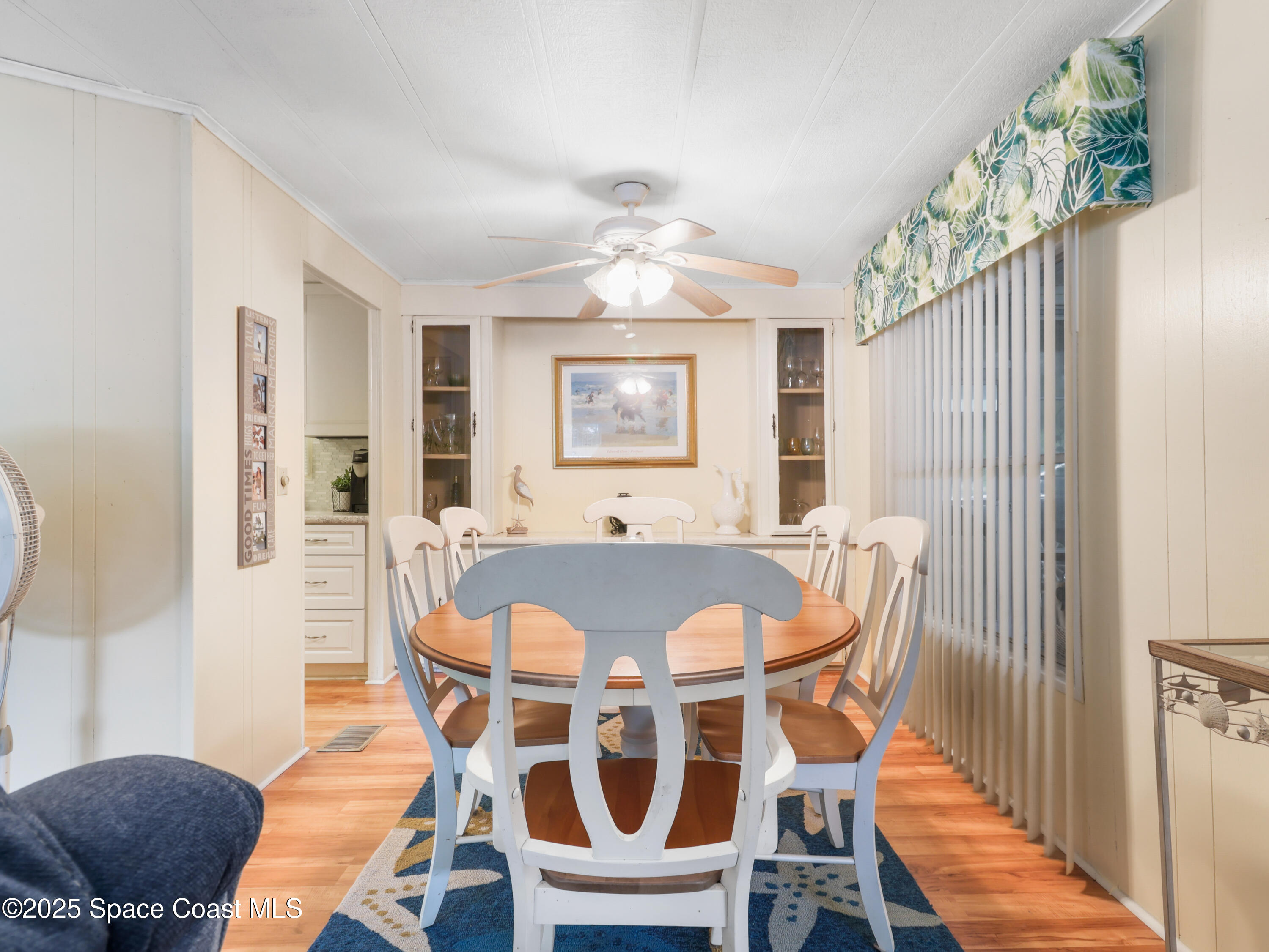 585 Canaveral Groves Boulevard Cocoa, FL 32926 - Photo 14 of 49 a view of a dining room with furniture and wooden floor