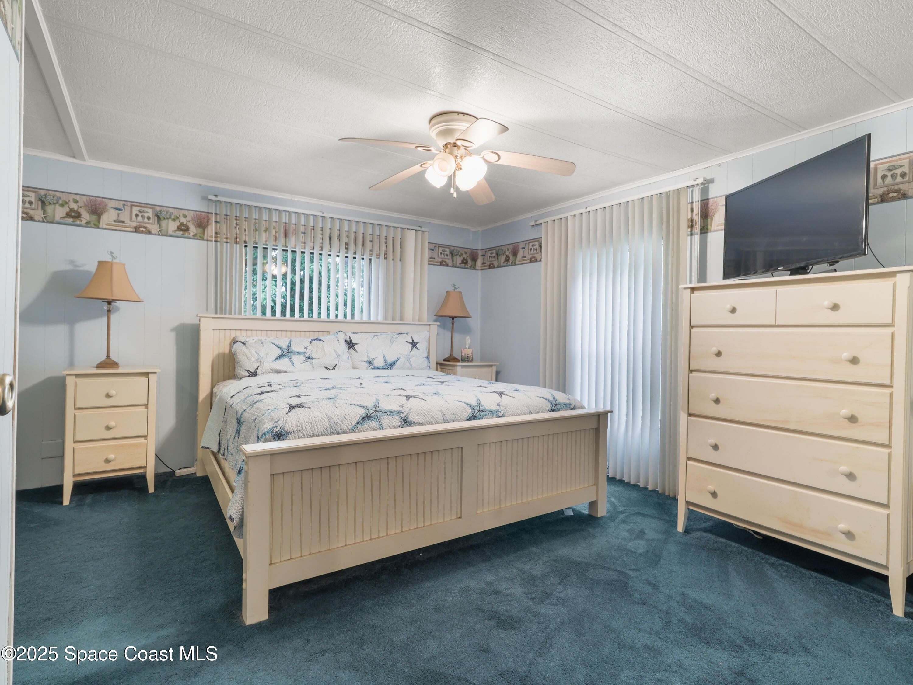585 Canaveral Groves Boulevard Cocoa, FL 32926 - Photo 19 of 49 a bed room with a bed and a television