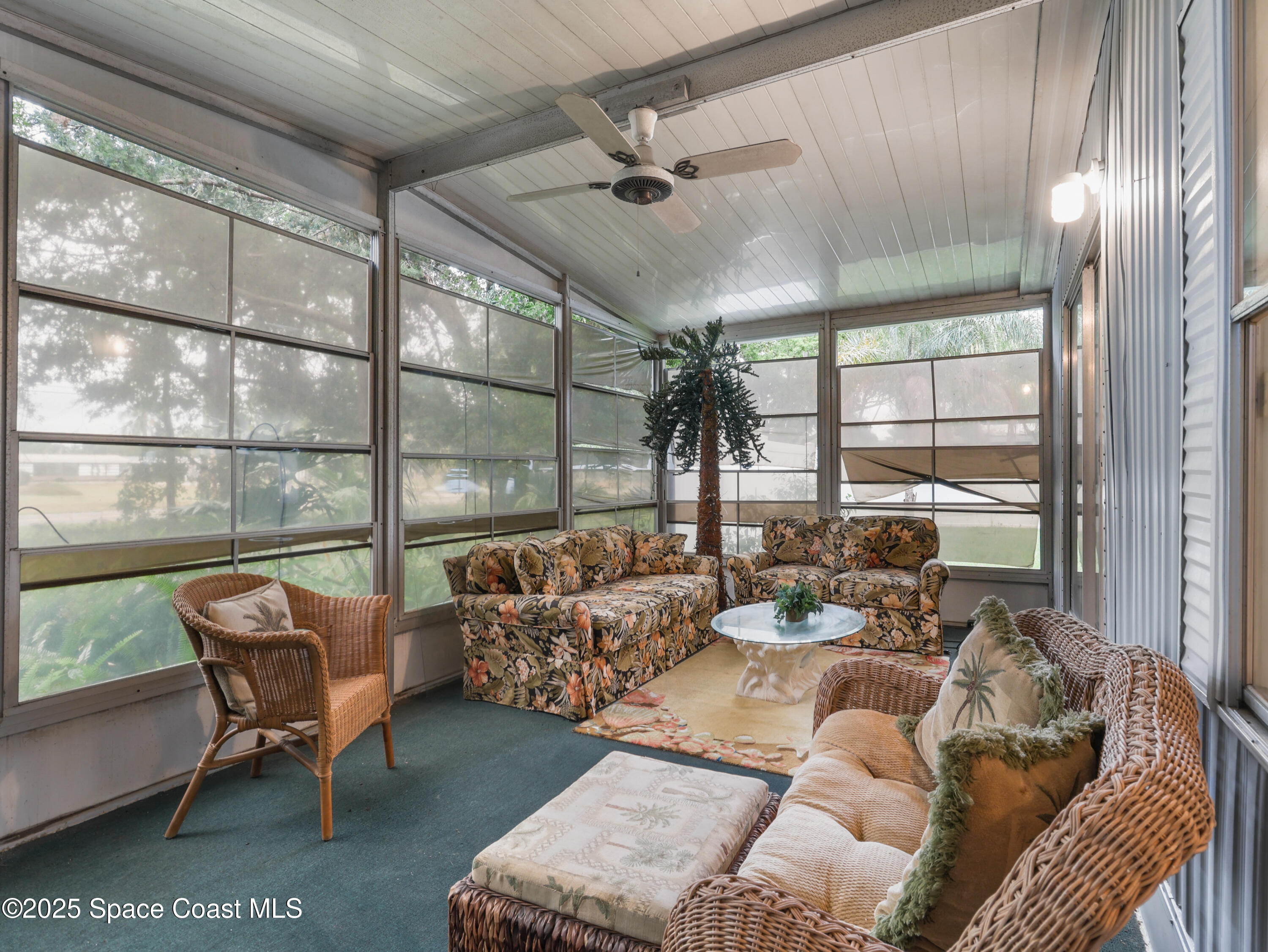 585 Canaveral Groves Boulevard Cocoa, FL 32926 - Photo 25 of 49 a living room with furniture and a large window