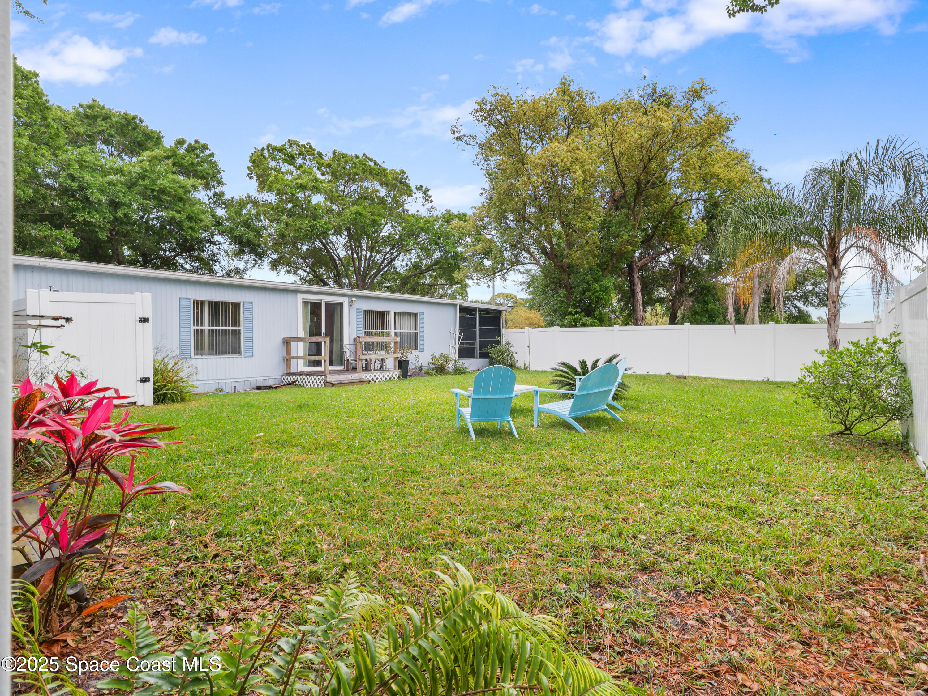 585 Canaveral Groves Boulevard Cocoa, FL 32926 - Photo 28 of 49 a house view with a sitting space and garden