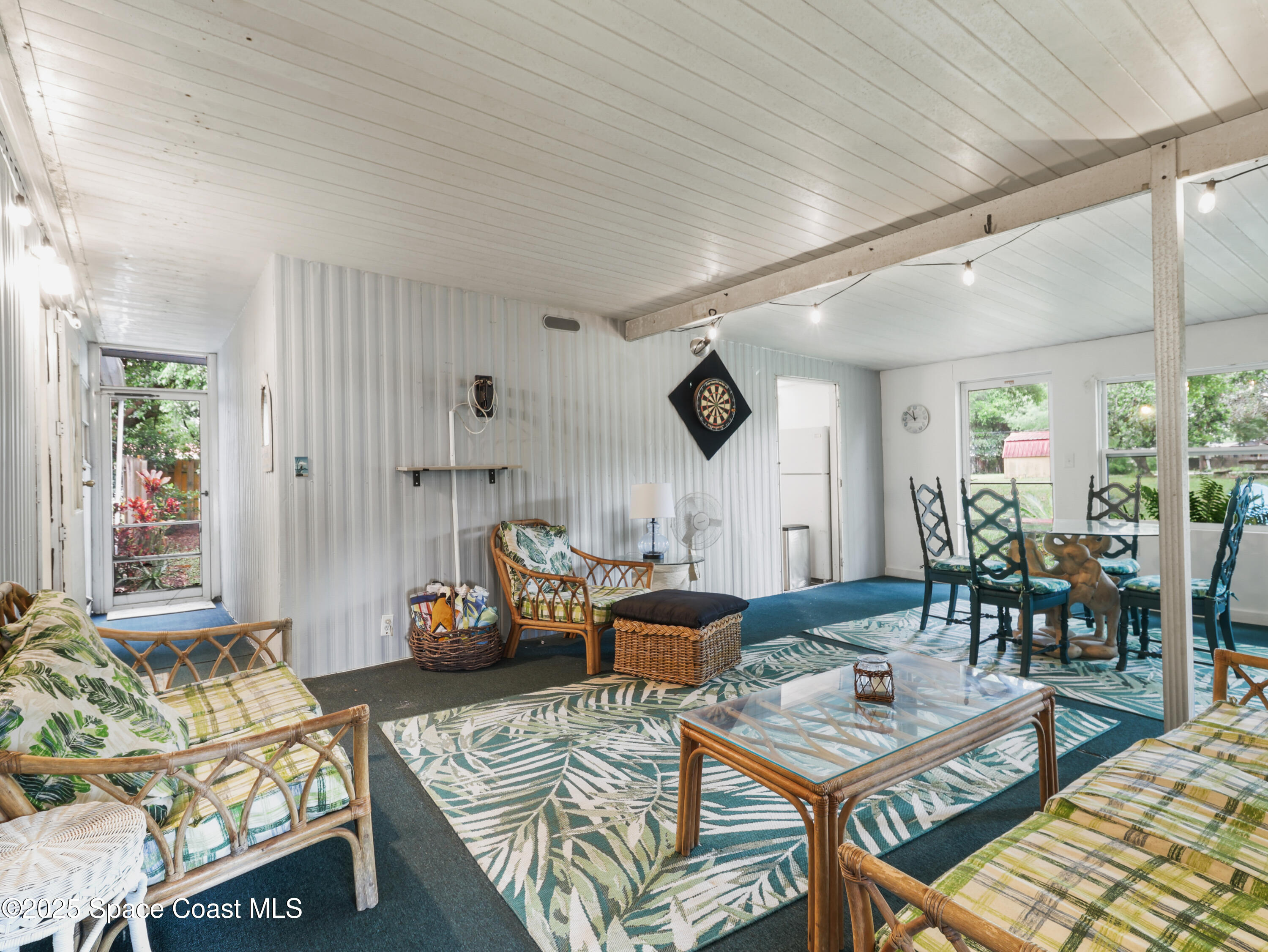 585 Canaveral Groves Boulevard Cocoa, FL 32926 - Photo 3 of 49 a living room with furniture and a large window