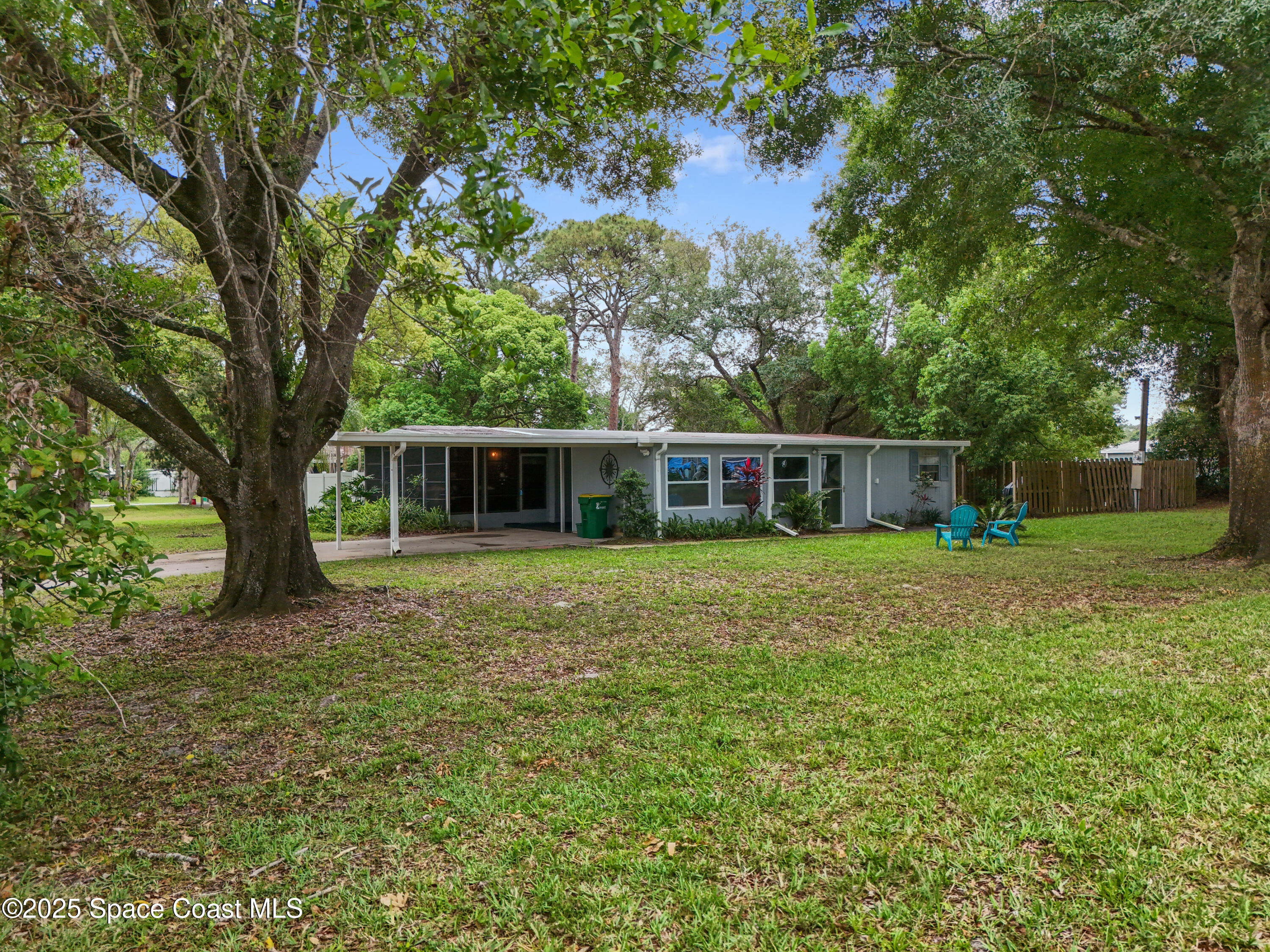 585 Canaveral Groves Boulevard Cocoa, FL 32926 - Photo 40 of 49 a front view of house with yard and green space