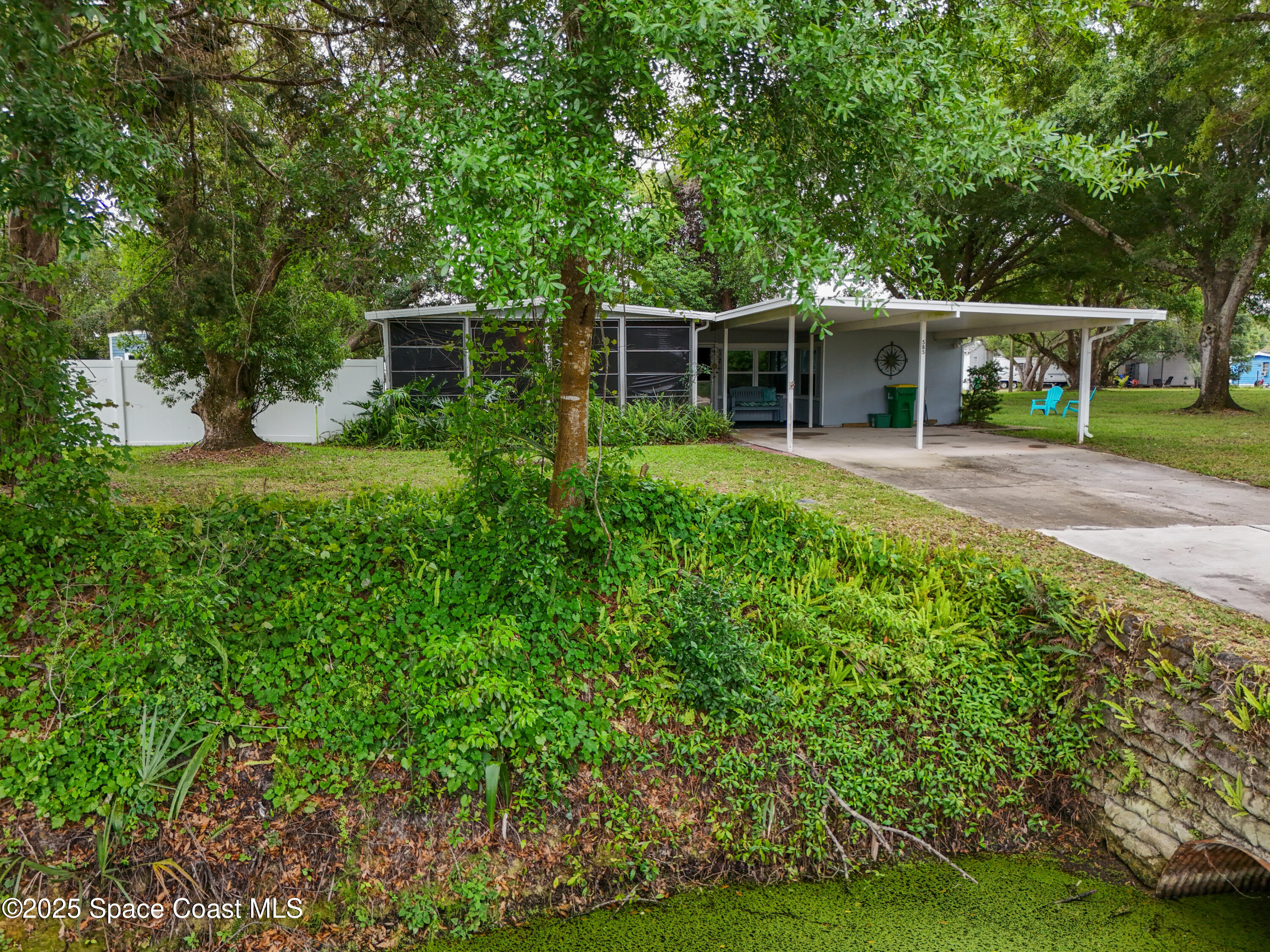 585 Canaveral Groves Boulevard Cocoa, FL 32926 - Photo 41 of 49 a front view of house with yard and green space