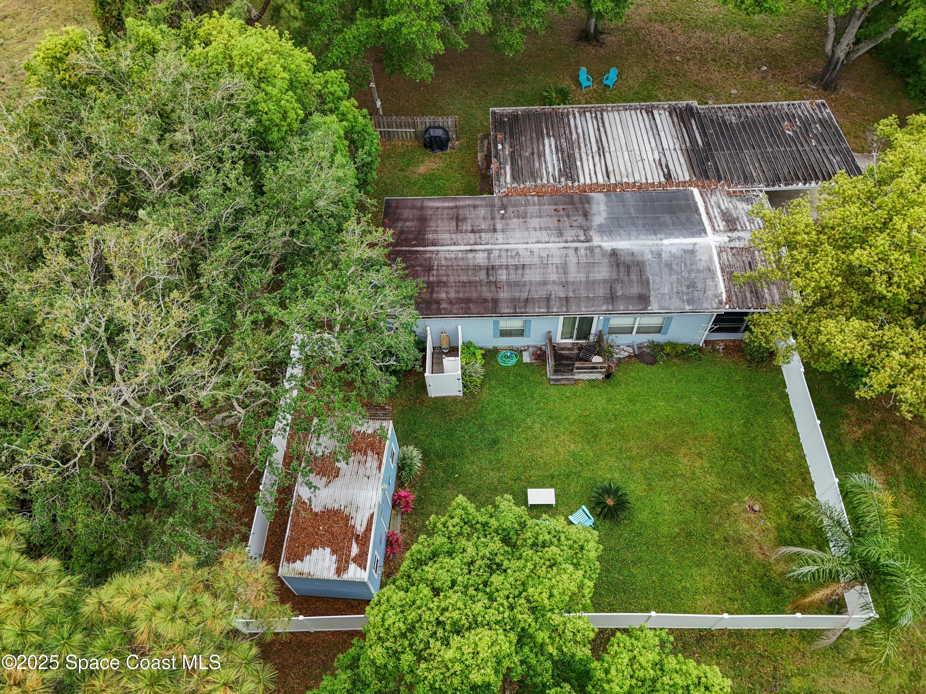 585 Canaveral Groves Boulevard Cocoa, FL 32926 - Photo 43 of 49 an aerial view of a house with garden space and street view