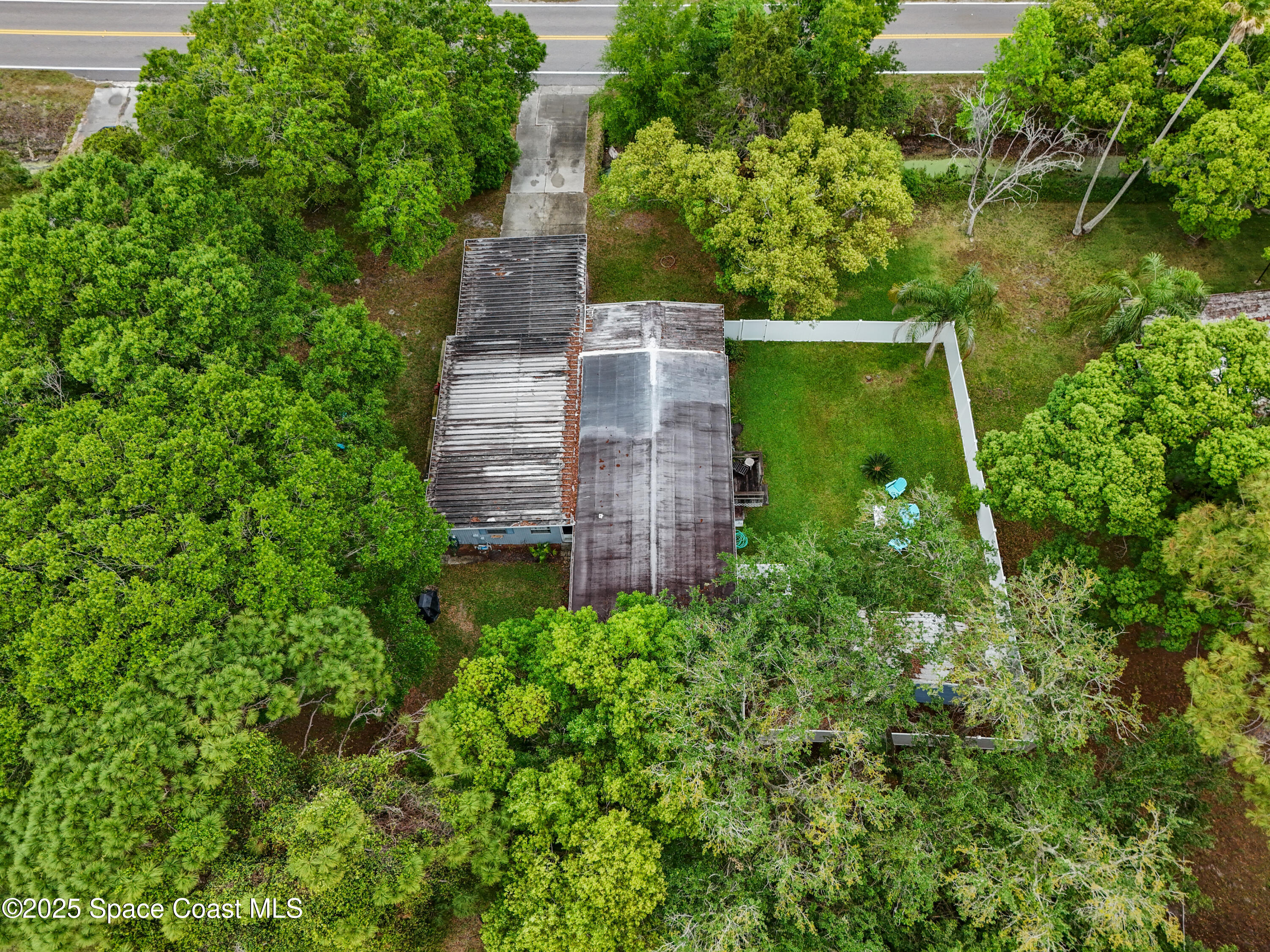 585 Canaveral Groves Boulevard Cocoa, FL 32926 - Photo 44 of 49 an aerial view of a house with a yard