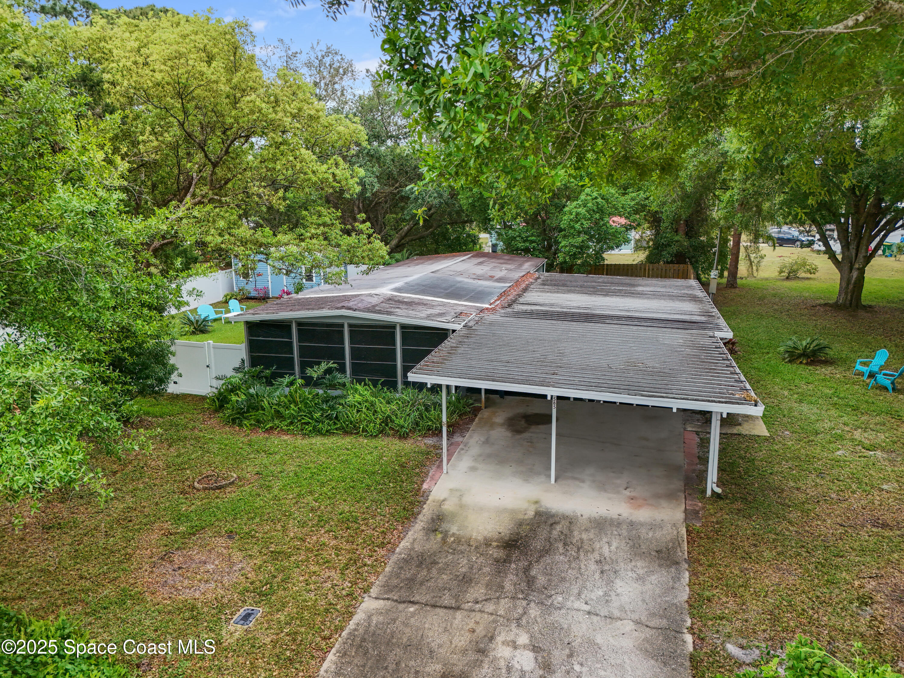 585 Canaveral Groves Boulevard Cocoa, FL 32926 - Photo 47 of 49 front view of a house with a yard