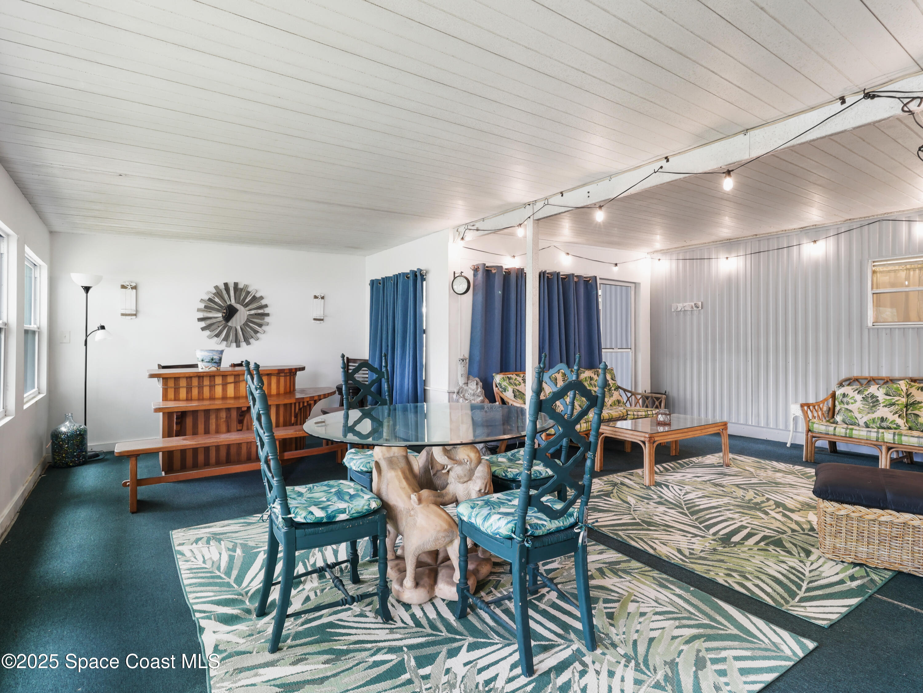 585 Canaveral Groves Boulevard Cocoa, FL 32926 - Photo 6 of 49 a living room with furniture a wooden floor and next to a window