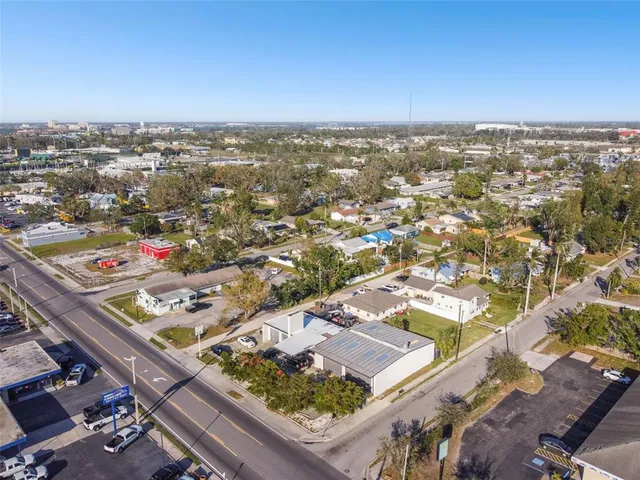 an aerial view of residential houses with city view