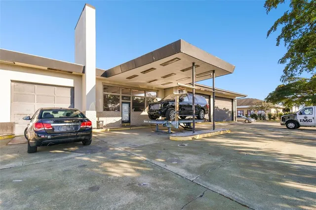 a view of a car parked in front of a building