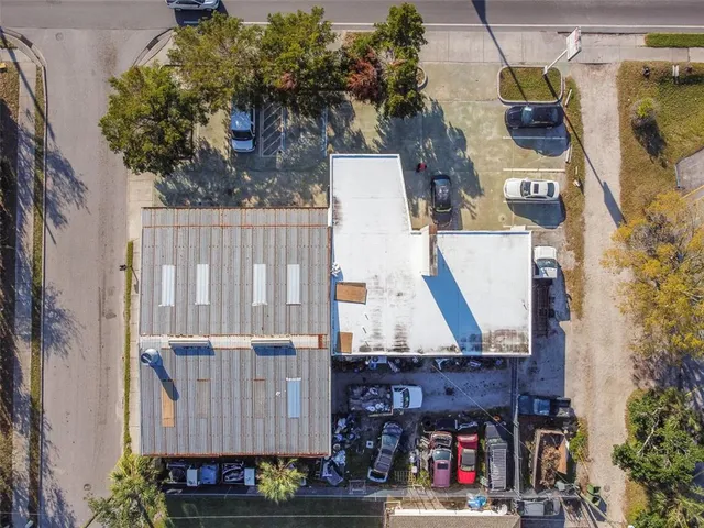 a view of a yard with car parked