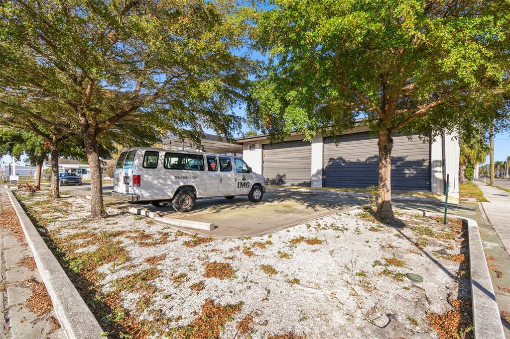 2011 9th Street West Bradenton, FL 34205 - Photo 9 of 24 a view of a yard with car parked