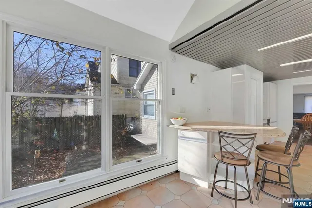 a room with a table and chairs