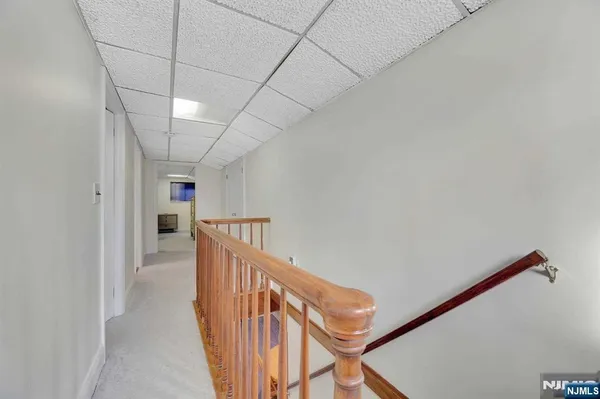 a view of a hallway with stairs