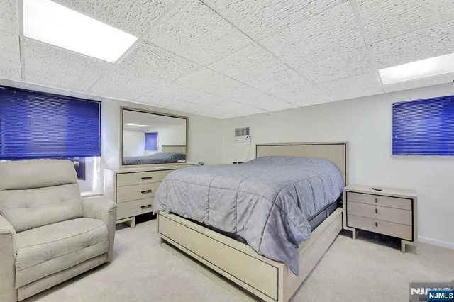 a spacious bedroom with a bed and a couch