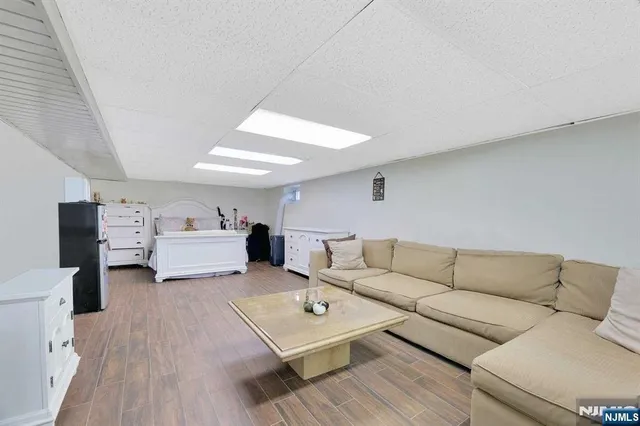 a living room with furniture and white walls
