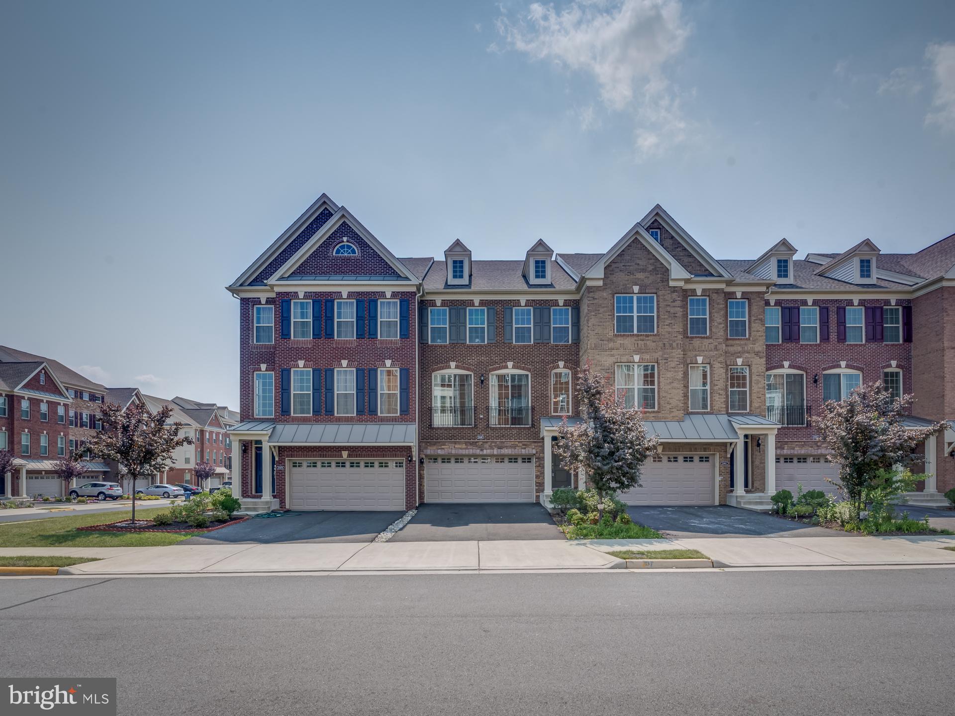 23480 Logans Ridge Terrace Ashburn, VA 20148 - Photo 2 of 66 front view of a house with a yard