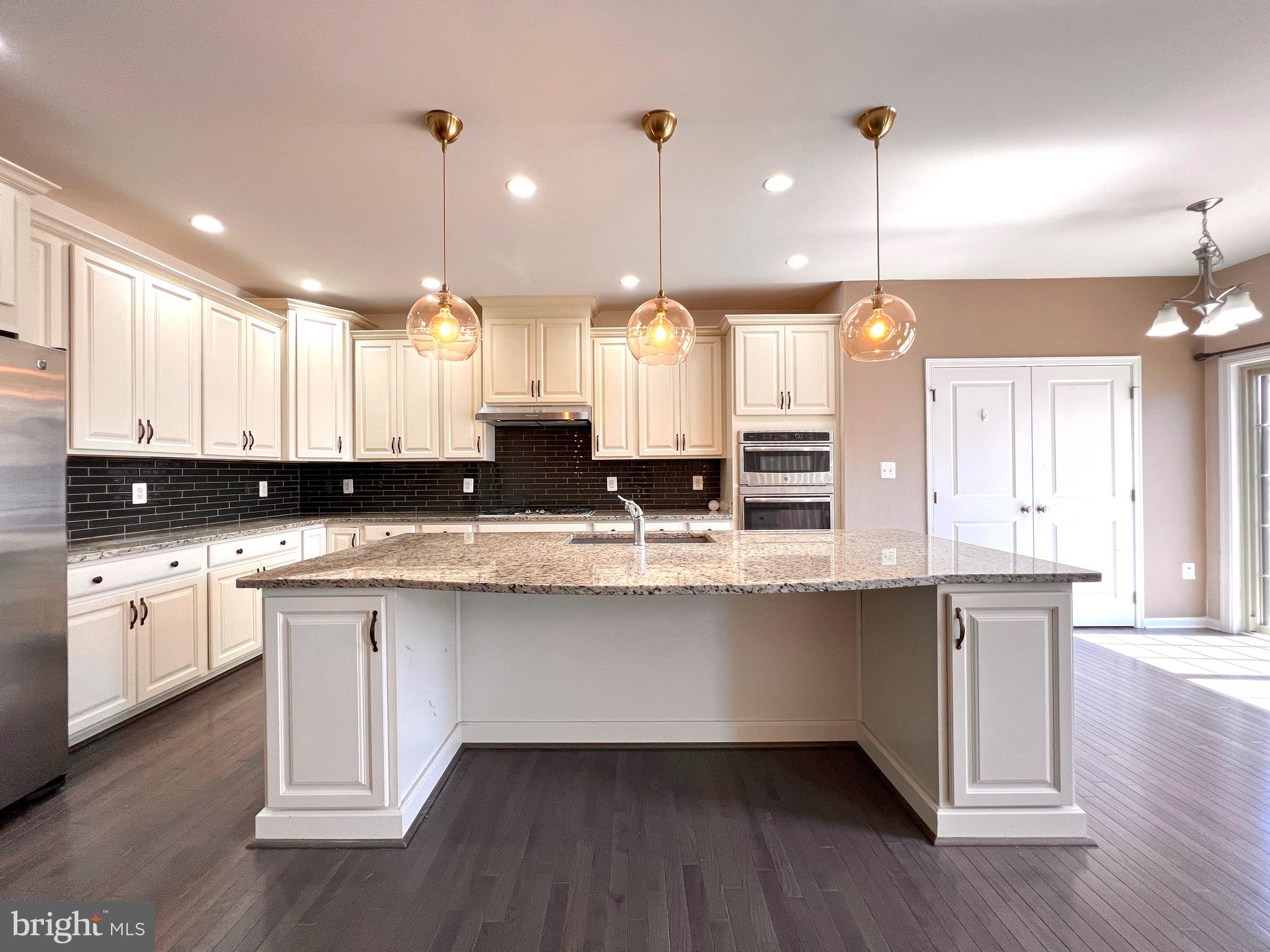 23480 Logans Ridge Terrace Ashburn, VA 20148 - Photo 22 of 66 a large kitchen with lots of counter space sink and appliances