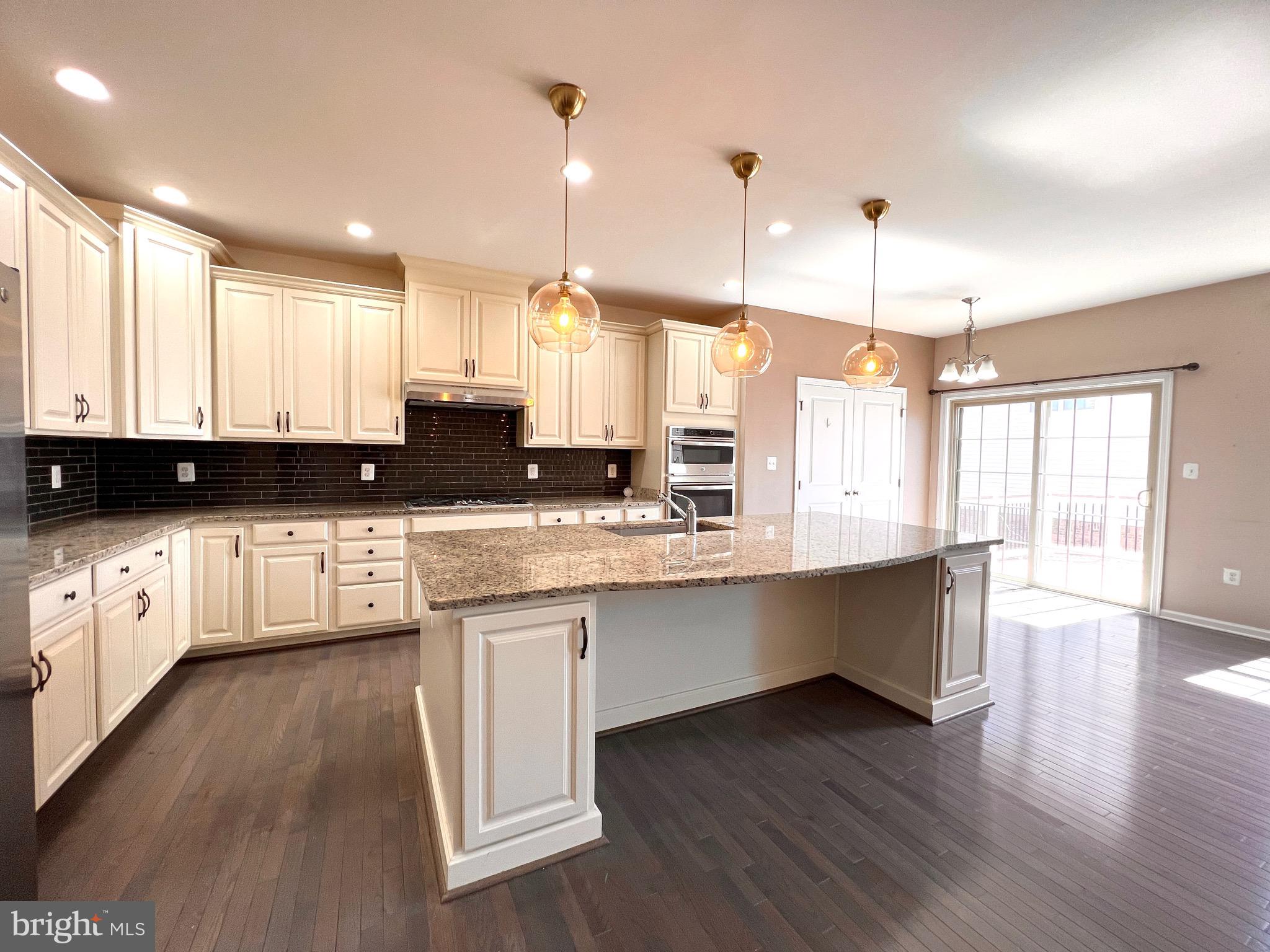 23480 Logans Ridge Terrace Ashburn, VA 20148 - Photo 23 of 66 a large kitchen with lots of counter space and a sink