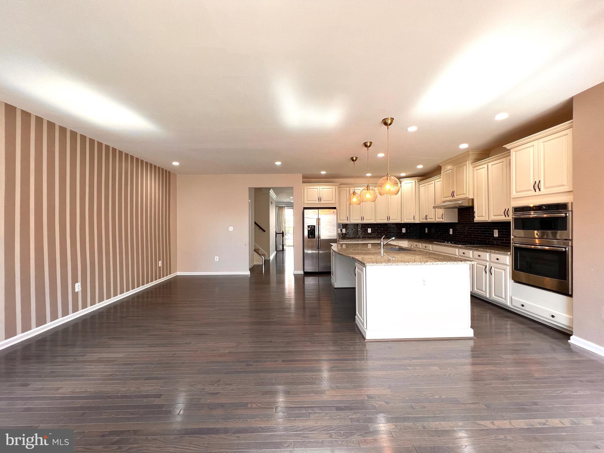 23480 Logans Ridge Terrace Ashburn, VA 20148 - Photo 25 of 66 a view of kitchen with refrigerator and microwave