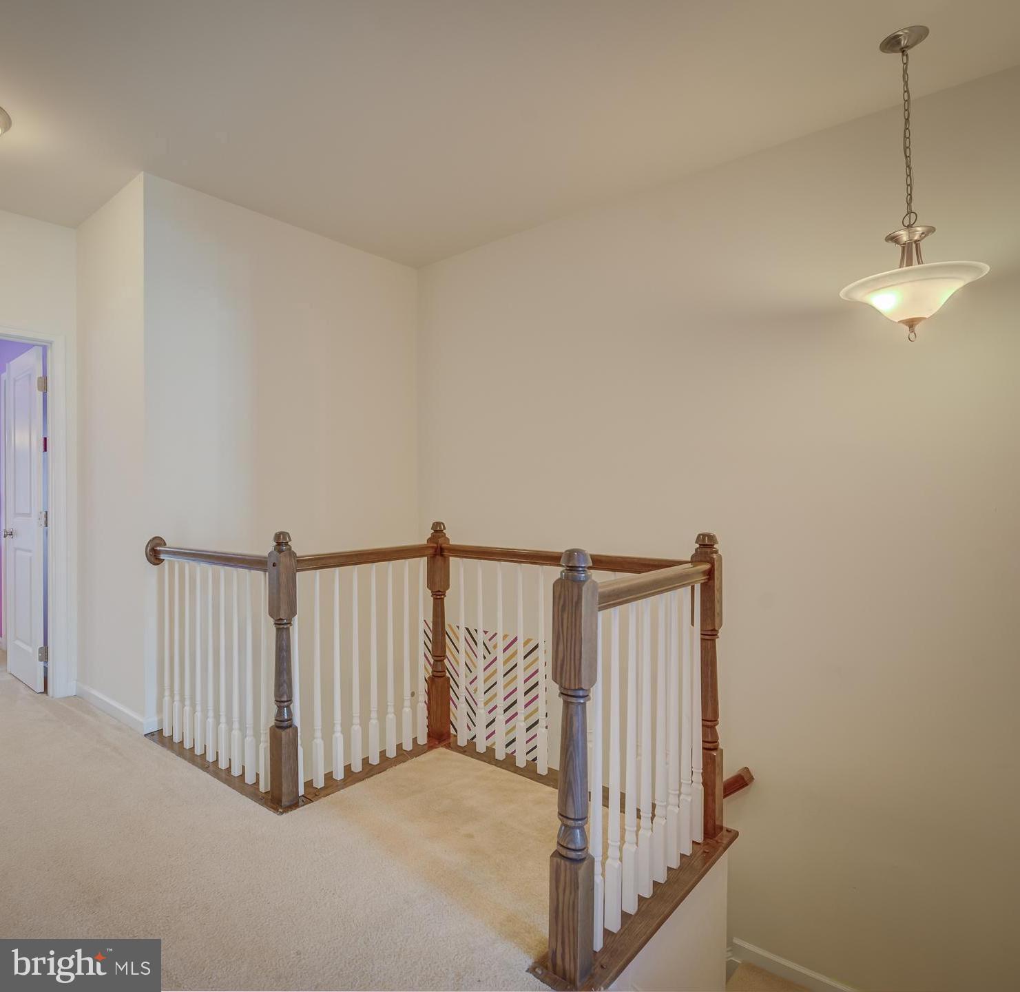 23480 Logans Ridge Terrace Ashburn, VA 20148 - Photo 33 of 66 a view of a hallway with staircase
