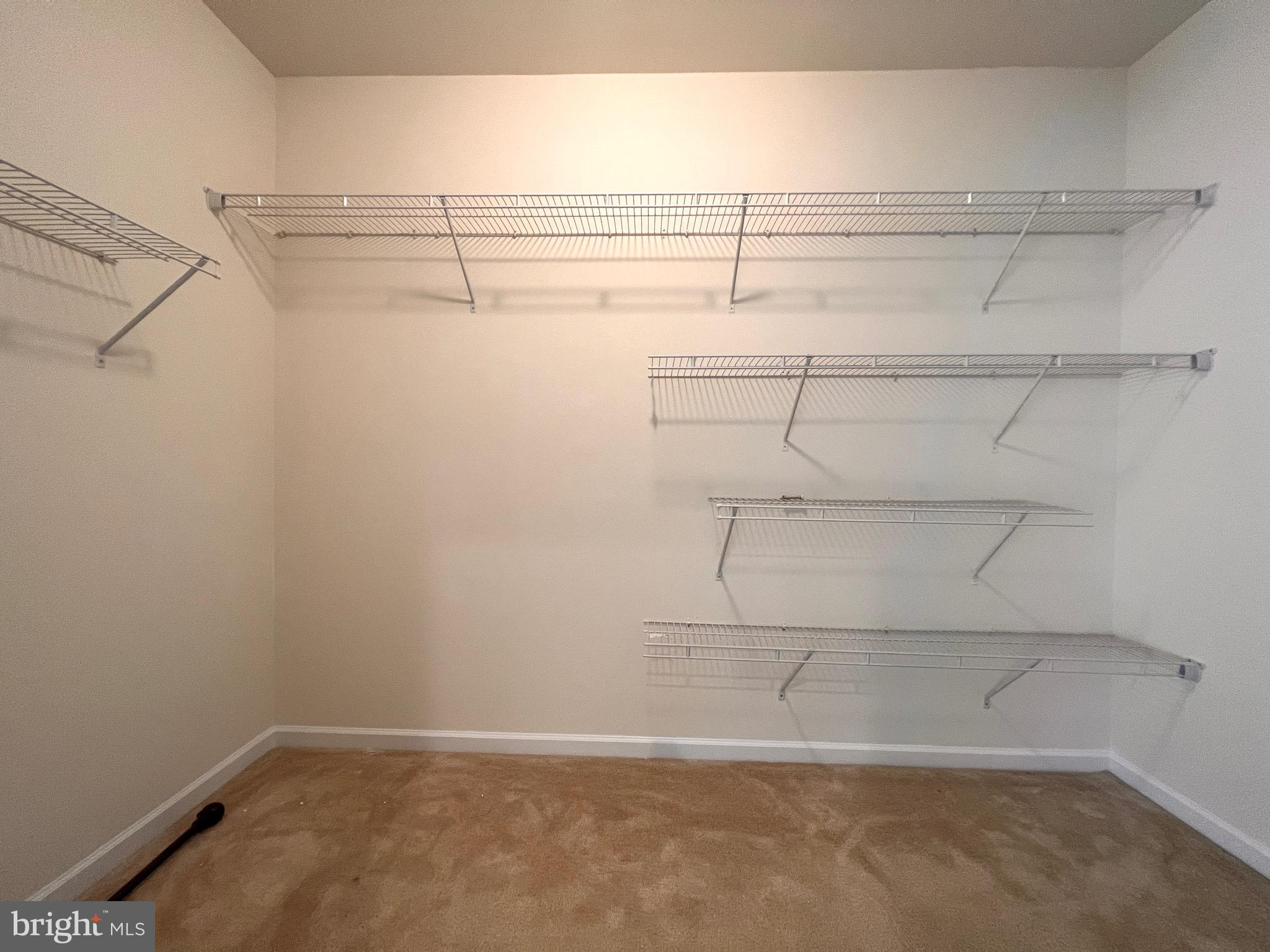 23480 Logans Ridge Terrace Ashburn, VA 20148 - Photo 48 of 66 a view of a room with racks on the wall