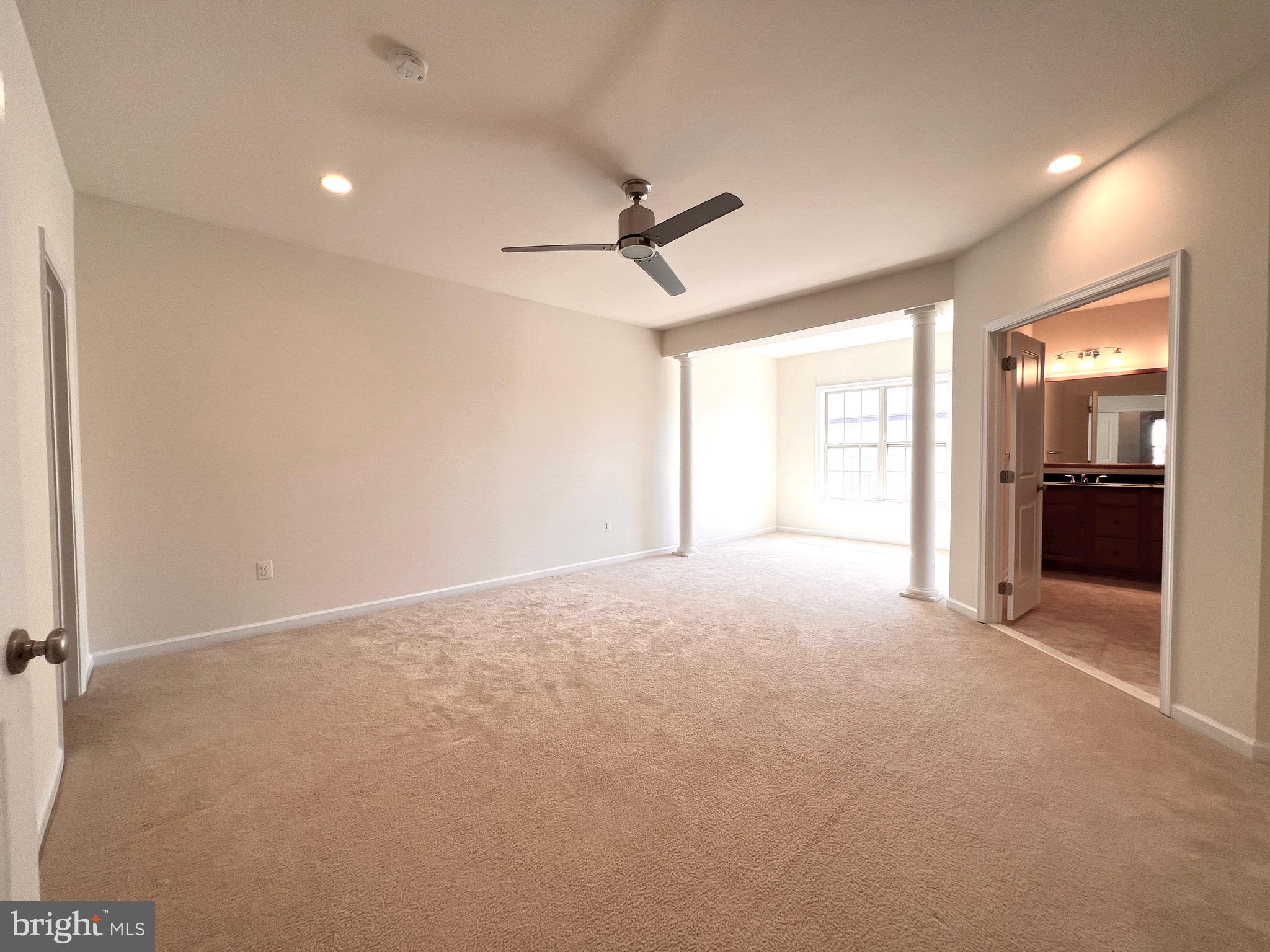 23480 Logans Ridge Terrace Ashburn, VA 20148 - Photo 49 of 66 wooden floor in an empty room with a window