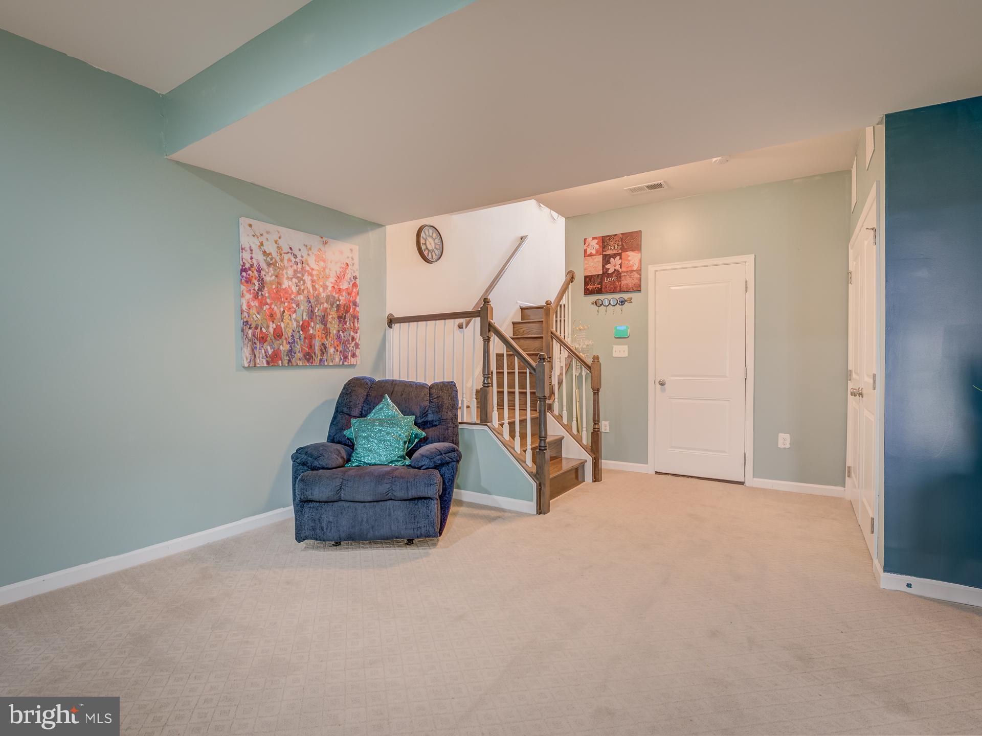 23480 Logans Ridge Terrace Ashburn, VA 20148 - Photo 55 of 66 a living room with furniture and a ceiling fan