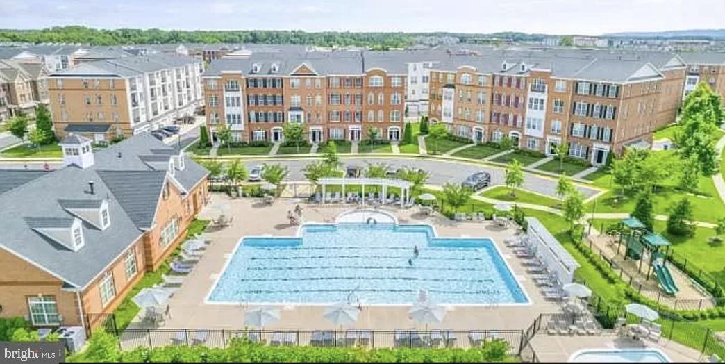 23480 Logans Ridge Terrace Ashburn, VA 20148 - Photo 66 of 66 a view of a swimming pool with a patio